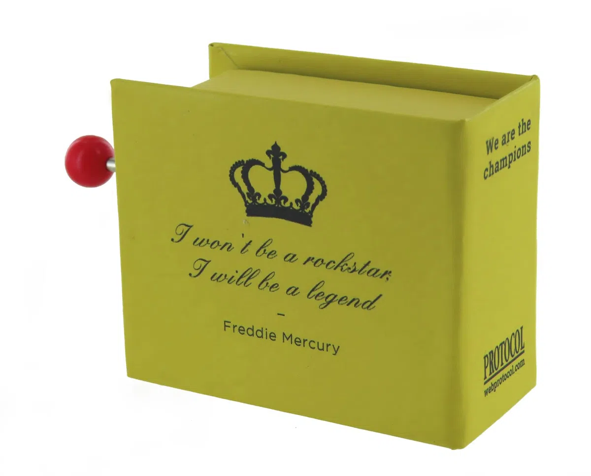 Caja de música/caja musical de manivela de cartón decorado en forma de libro con mecanismo musical de 18 notas - We are the champions (Queen - F. Mercury)